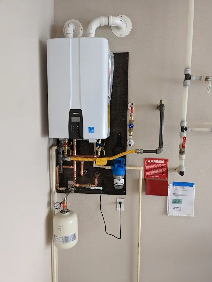 Professional plumber installing copper piping in a Allentown home